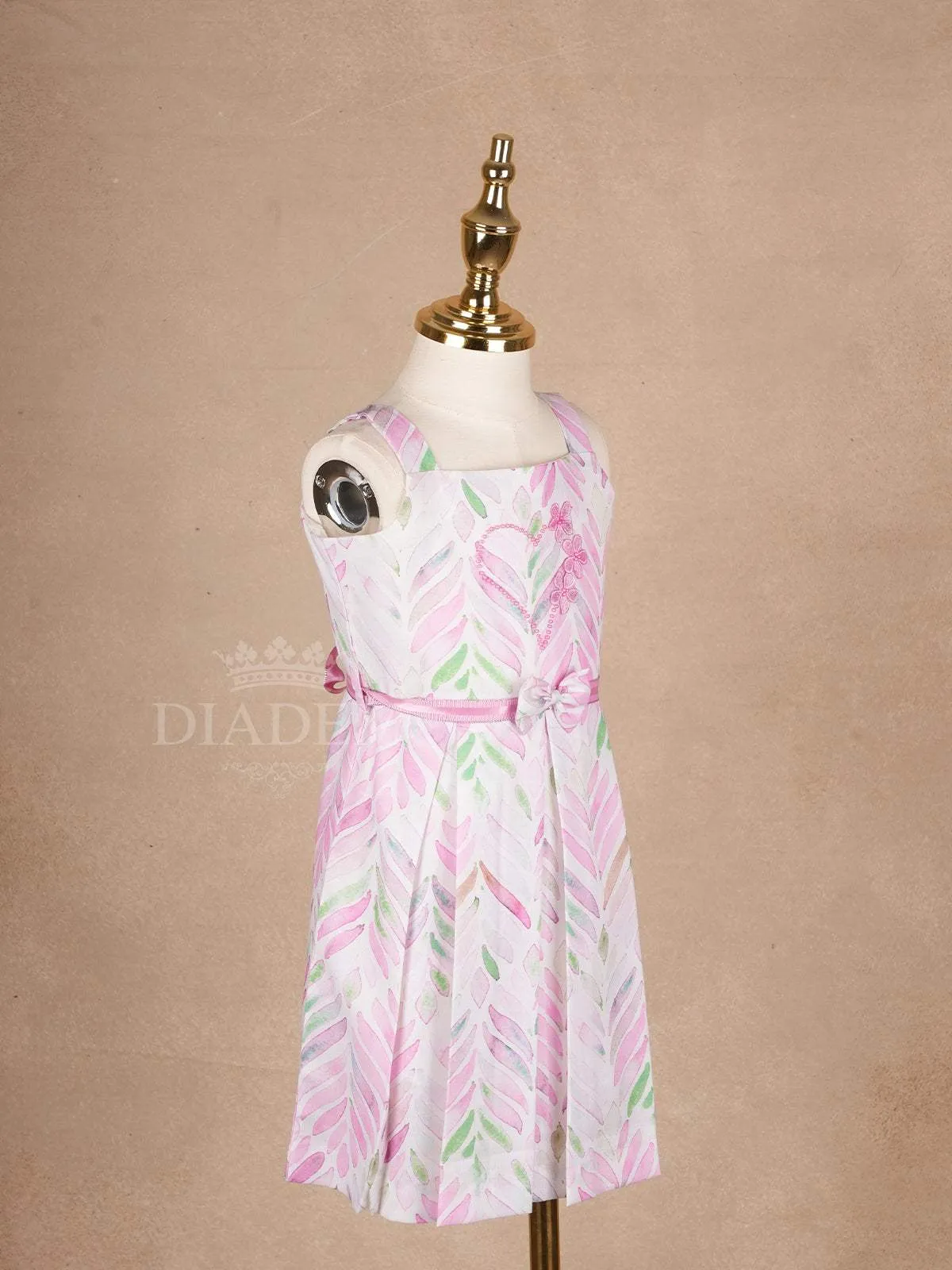 White Cotton Frock Adorned with Floral and Leaves Pattern and Sleeveless for Girls